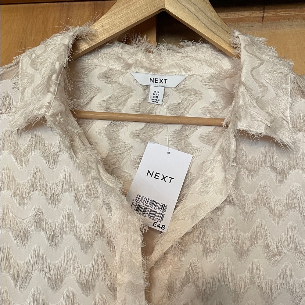 NWT Next Clothing UK Cream Textured Button-Down Blouse With Fringe Details
SZ 12